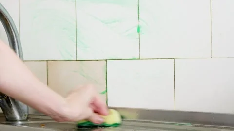 Sponge to rinse cleaning product white tiles Stock Footage 342994259