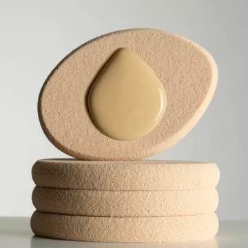 Sponge_with_drop_of_foundation_liquid_foundation_make_up Stock Photos