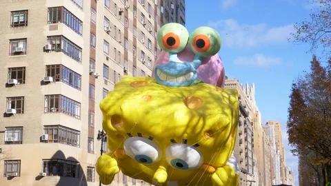 Spongebob SquarePants and Gary Balloon in the Macy's Thanksgiving Day Parade Stock Footage 120712616