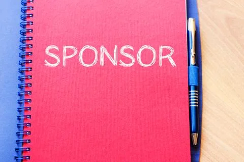 Sponsor write on notebook Stock Photos