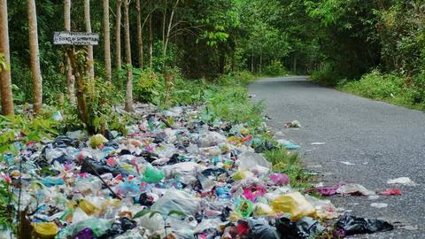 Spontaneous garbage dump along the road in Indonesia Stock Photos