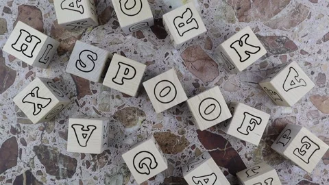Spoof concept with frame of random alphabet letters on cubes. Rotating table Vídeos de archivo 151853430