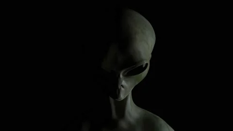 Spooky alien's face on black background. UFO and extraterrestrial life concept. Stock Footage