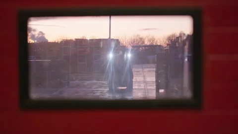 Spooky atmosphere of looking out through the window of a warehouse   Stock Footage 252077337