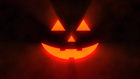 Spooky bright Halloween background animation. Scary glowing pumpkin face Stock Footage 252935307