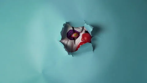 Spooky clown will send shivers down your spine, with a bone-chilling blue Stock Footage 234983976