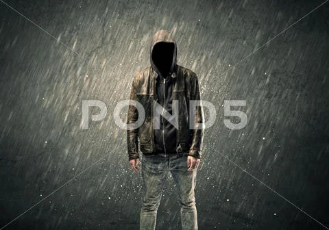 Spooky faceless guy standing in hoodie Stock Photos