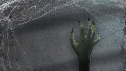 A spooky, ghoulish hand with long, sharp, dark fingernails reaching out fro.. Stock Photos