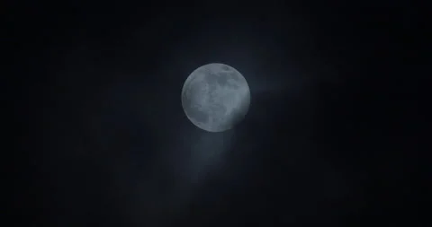 Spooky Glowing Full Moon with eerie clouds passing over Stock Footage 144157348