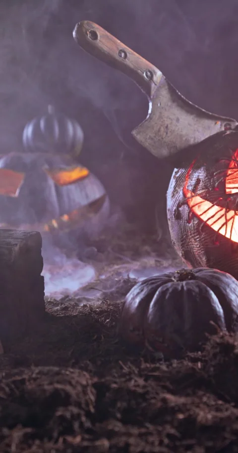 A spooky glowing pumpkin with chopper head-first at night. Stock Footage 347018596