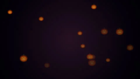 Spooky Halloween glowing pumpkin faces seamless loop background Vídeo Stock 343726313