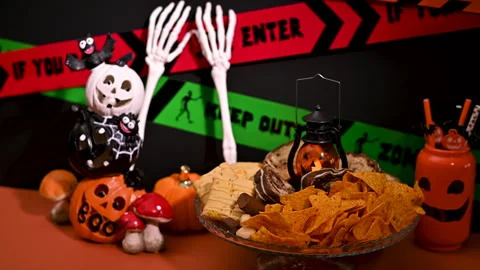 Spooky Halloween Table Decor: Snacks and Sweets Spread Stock Footage 251517687