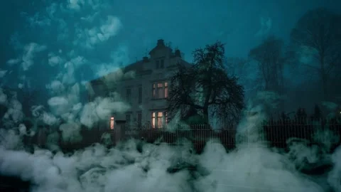 Spooky haunted house at night surrounded by thick fog Stock Footage 334105103