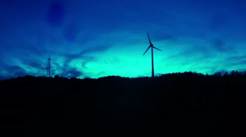Spooky horror modern windmill establishing shot creepy blue tint Stock Footage 43748901