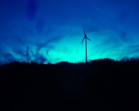 Spooky horror modern windmill establishing shot creepy blue tint, click for HD Stock Footage 43910291