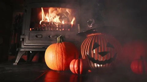 Spooky Jack O lantern infront of fireplace with smoke passing through 스톡 동영상 140916266