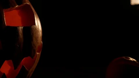 Spooky jack-o-lantern or carved pumpkin lantern burning in darkness. Stock Footage 116154417