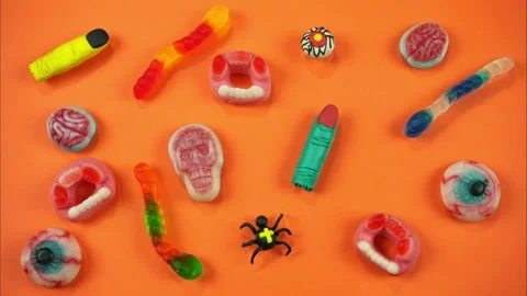 Spooky jelly candies appears and disappears with moving worms. Stop motion Stock Footage 253742953