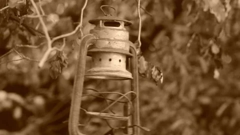 Spooky Old broken lamp swinging in tree. Stock Footage