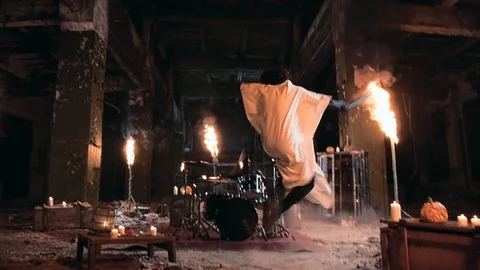 Spooky psycho in a mask with a baseball bat. Drummer plays drums Stock-Footage 92177355