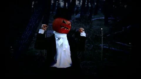 Spooky Pumpkin Headed Man Dancing And Having Fun In The Dark Forest At Night Stock Footage 141259878