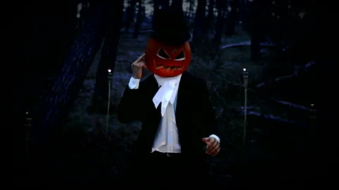Spooky Pumpkin Headed Man Making A Finger Pointing Gesture To Head In The Forest Stock Footage 141256831
