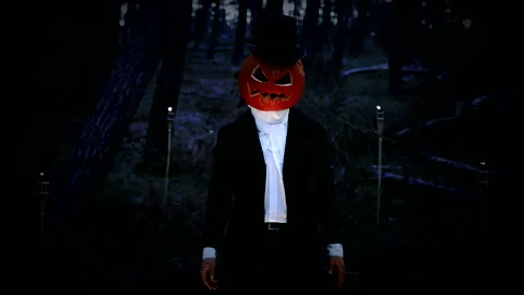 Spooky Pumpkin Headed Man Making A Hand Creepy Welcoming Gesture In The Forest Stock Footage 141257533