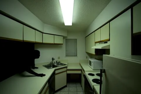 Spooky Shadow Person Emerging into Kitchen Stock Photos