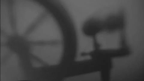Spooky Spinning Wheel Shadow on Wall in Black and White Stock Footage 162451691