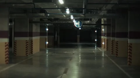 Spooky underground parking moving backwards Stockbeeldmateriaal 318156476