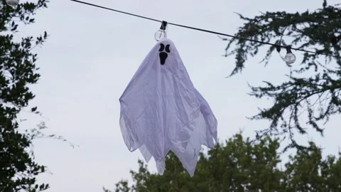 Spooky White Ghost Decoration Hanging Outdoors for Halloween Stock Footage 319470494