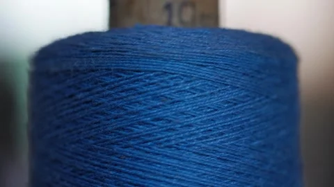 Spool of blue cotton thread for sewing macro 動画素材 281590437
