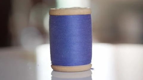 Spool of blue cotton thread for sewing close-up 動画素材 281590453