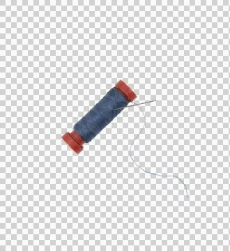 A spool of blue sewing thread with a needle Stock Photos