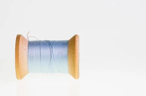Spool of blue thread isolated 写真素材