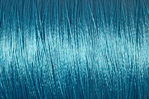 Spool of blue thread macro background Stock Photos