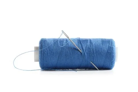 Spool of blue thread with needle on white background Stock Photos