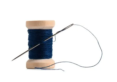 Spool of blue thread with needle on white background Stock Photos