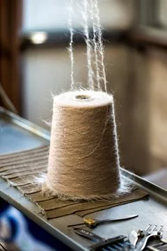 Spool of brown Thread on Industrial Sewing Machine Stock Photos