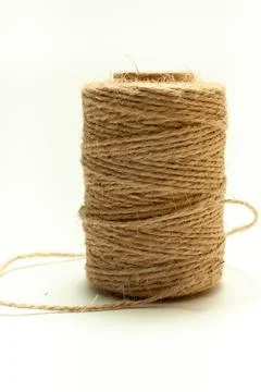 Spool of coarse thread on a white background Stock Photos