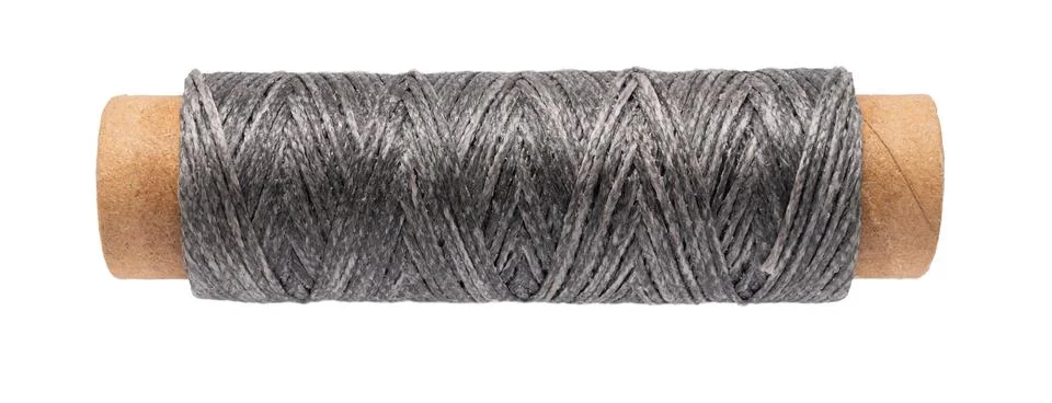 Spool of colored thread on a white isolated Foto stock
