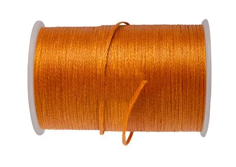 Spool of colored thread on a white isolated Foto stock