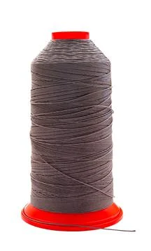 Spool of colored thread on a white isolated Foto stock