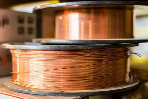 Spool of copper wire, bronze cable in reels at industry production 스톡 사진