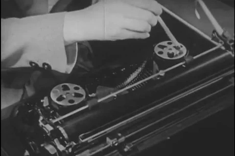 The spool cover is removed, the shift lock key is pressed, the ribbon indicator Stock Footage 99668846