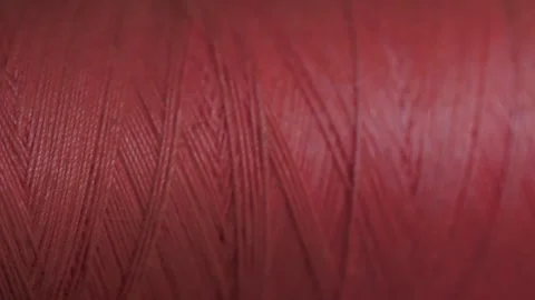 Spool of crimson cotton thread for sewing macro 動画素材 281590421