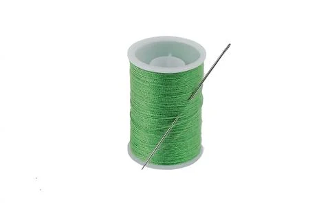 A spool of green threads with a needle stuck in them isolated on a white back Stock Photos