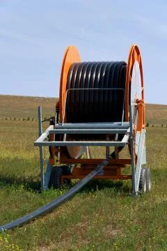 Spool of irrigation pipe Stock Photos