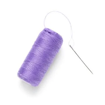 Spool of purple thread with needle on white background Stock Photos