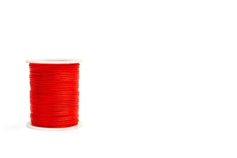 A  spool of red sewing thread on a white background Stock Photos